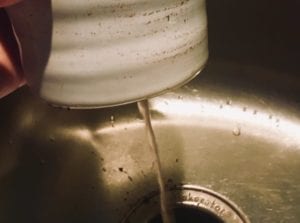 water running out of the bottom of a succulent pot