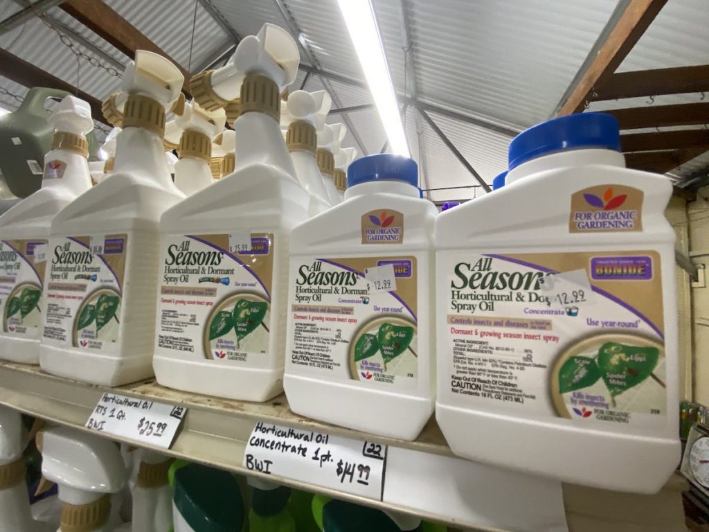 Dormant Oil spray on shelves at nursery.